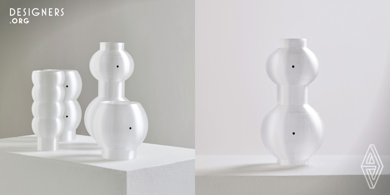 The 'BUBBLE' is a series of vase designs resembling bubble shapes. The vases are made from 3D printing using an environmentally friendly plastic. In addition, they have created an unique atmosphere by pointing the center of the vase with oriental green paint. The difference with other vases is that the product decomposes spontaneously when the product reaches its end of life.
