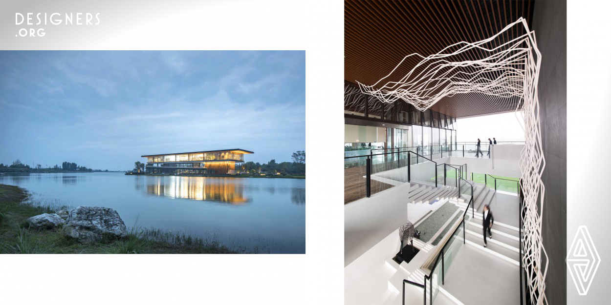 This project is a simple and modern architecture with two floors. As the building is surrounded by the water, people can feel comfortable when they enjoy the beautiful scenery from the glass wall. The designer gets the idea from a famous Chinese poem, to express the flowing water in the interior design way. People seems like to be in the nature when they in this environment.