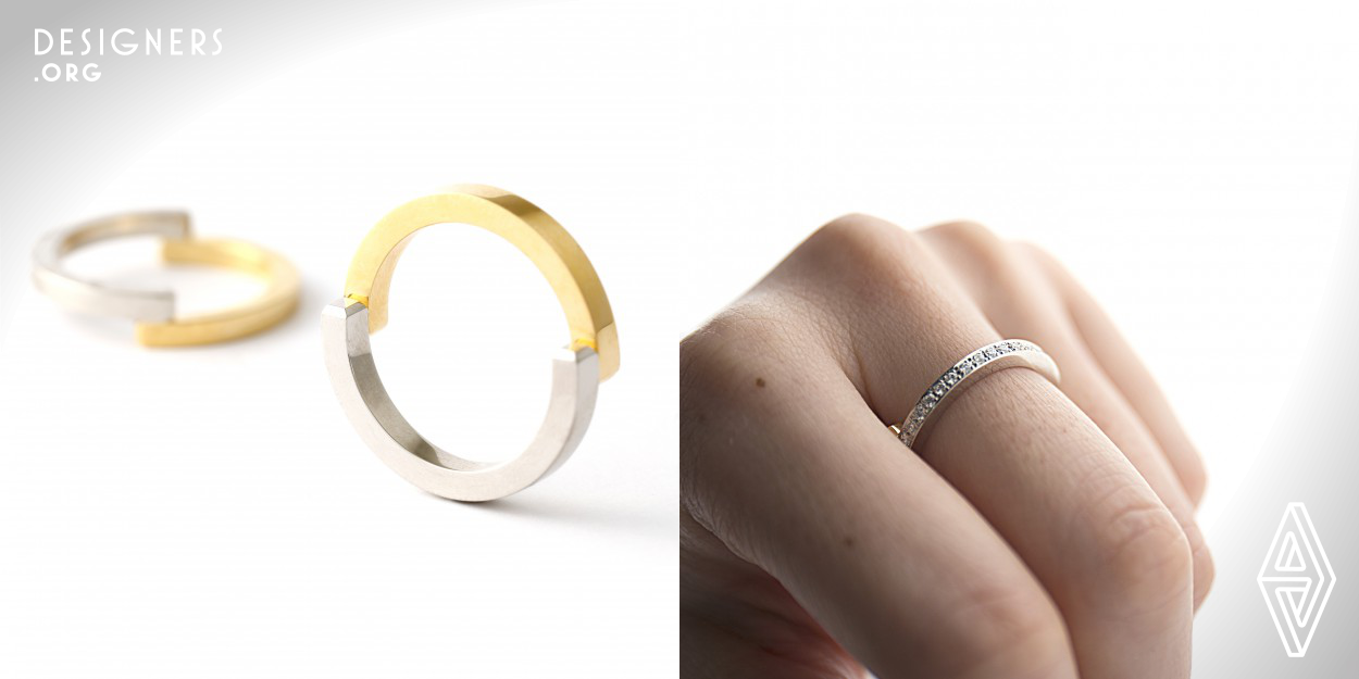 With a simple gesture, an action of touch conveys rich emotions. Through the Touch ring, the designer aims to convey this warm and formless feeling with cold and solid metal. 2 curves are joined to form a ring that suggests 2 people holding hands. The ring changes its aspect when its position is rotated on the finger and viewed from different angles. When the connected parts are positioned between your fingers, the ring appears either yellow or white. When the connected parts are positioned on the finger, you can enjoy both yellow and white color together.