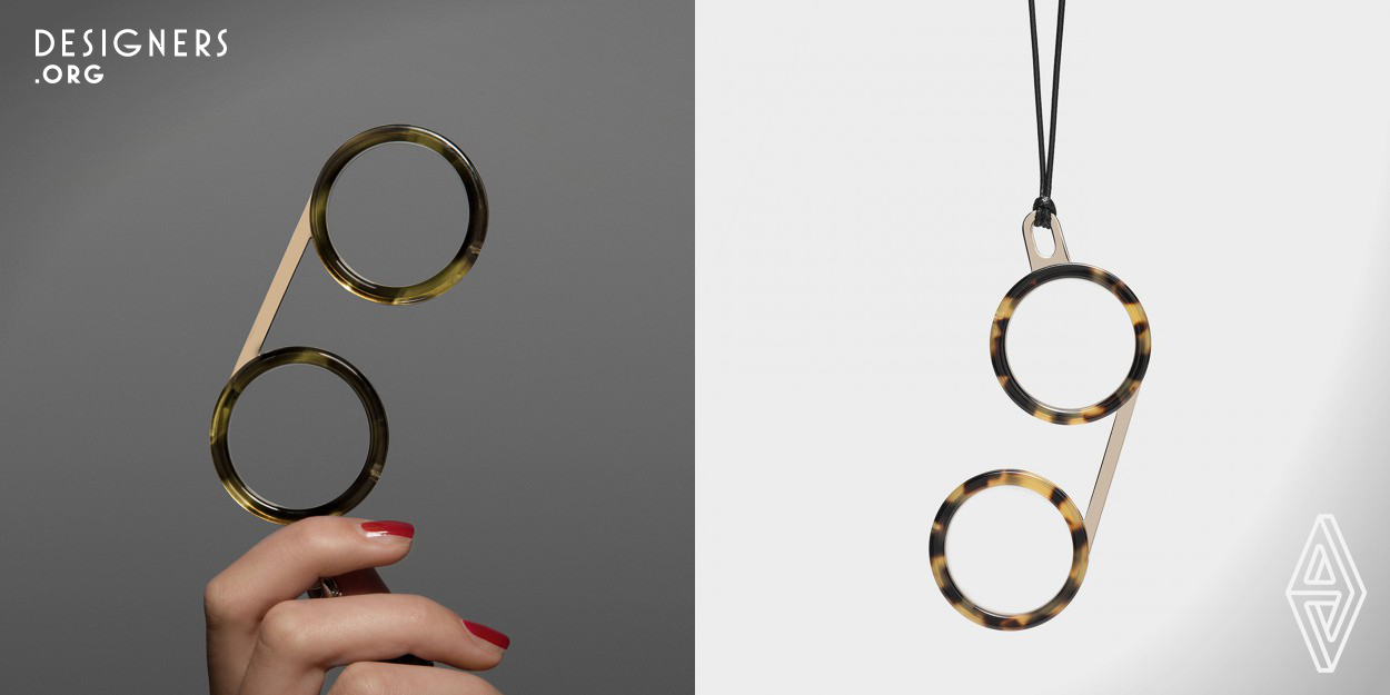 Fassamano, inspired by the shapes of the early glasses, is thought to be worn around the neck and designed as a combination of pure forms. Two circles for the eye rims and a line for the bridge.The handle, also minimal in its design, has a double function: grab to the use and eyelet for the cord. The glasses weight only 20 grams. Crafted with CNC technology and hand polished afterwards. The eye rims are made in acetate with a glossy finish and the bridge is in alpacca with different finish.