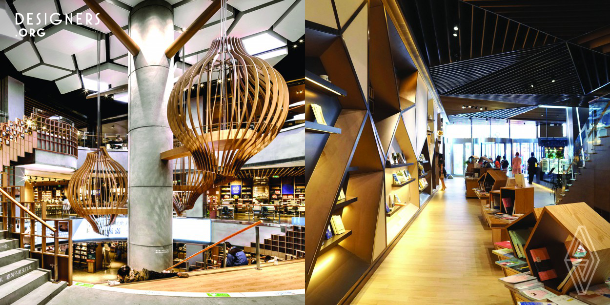 Jato Design was tasked with transforming a traditional bookstore into a dynamic, multi-use space – to be not only a shopping mall but also a cultural hub for book-inspired events and more. The centrepice is the “hero” space where visitors move to a lighter-toned timber-putfitted environment enhanced with dramatic designs. Lantern-like cocoons hang from the ceiling while stairways serve as communal spaces that encourage visitors to linger and read while sitting on the steps.