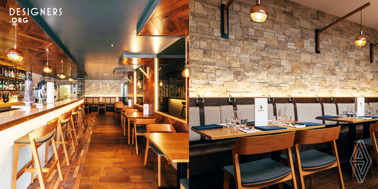 Family run restaurant was enlarged by joining two buildings and an open courtyard to double the seating capacity. Andalucia in the Sussex village of Ferring consists of two bars and a private dining room as well as 50 cover restaurant. Stone walled dining room, sliding skylight windows with fully grown olive tree are reminder of its former courtyard use. Spanish hams are hanging inside a glass and Himalayan rock salt unit which were chosen for its water absorbing and and air purifying properties. Independent bar is positioned at the front of the property doubling up as a holding bar.