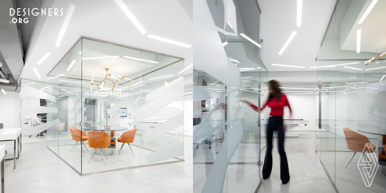With only two windows allowing natural lightening, and a square shape divided in small areas, the challenge was to create a common working, an additional two individual cabinets and a meeting room. We create an open space irregular geometric shapes combined distinct ceiling and floor texture as a way to cut with the previous floor plan. 
Noble materials were used and of Portuguese origin as the white marble.The privacy for workstations was achieved with the use of glass and an informal touch was given designing a play area. 
