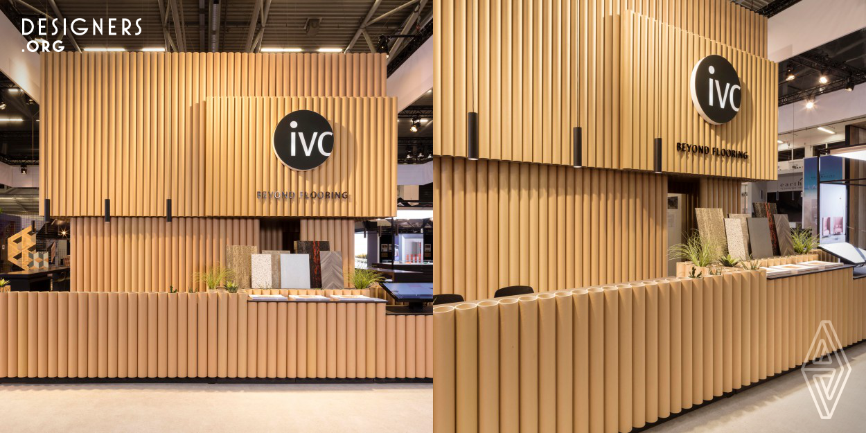 The exhibition booth was designed to reconnect people with the core of IVC: the mother rolls of the base materials. They were upcycled & integrated in the heart of the booth. The rolls are used as an architectural element and can be used again in production after the trade show. The design illustrates the vision that IVC wanted to communicate: to think beyond flooring. The floor of the booth also contained a work of art by Glenn Sestig, demonstrating the possibilities of the collection. 
