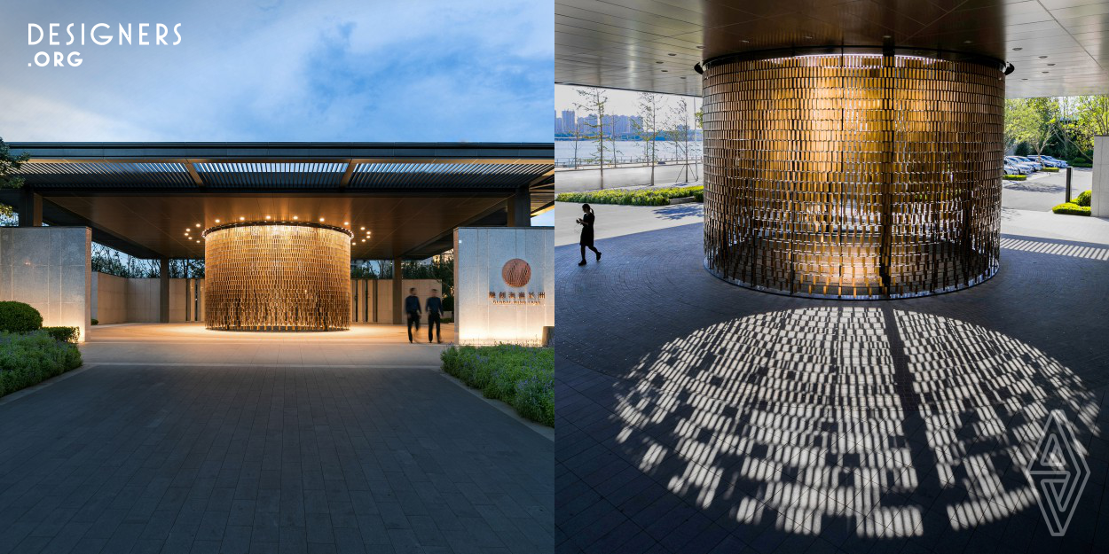 This installation was designed using the language of the sea: waves, as it was designed for a residential project along the shore of Dalian Bay, China. The installation is a huge cylinder formed by double-layer copper plates, consisting of 6000 plates hung in the frame according to specific permutation. When walk around the cylinder, this installation looks like waves running one after another. When the plates move in the sea wind, flashing light and colors are reflected, symbolizing spindrift. This design reprodued the vibes of the sea waves with a fixed installation. 