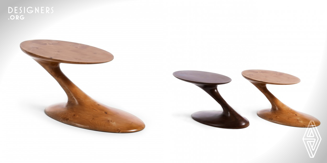 A side table been as sculpture.The combination of technology and design makes the Peyto as a sculpture. The wood in this design is showing the behavior of fluid materials like concrete. Not only the form, but it presents a special function. The unique way of standing gives the user the opportunity of pulling Peyto into his/her bench. It makes Peyto a side table which can be an inside table, too.