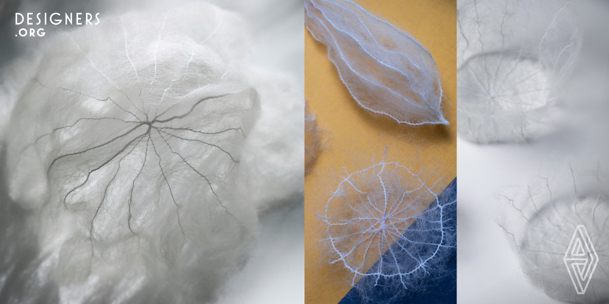 This work ruled out felting, commonly used in wool manufacturing processes of everyday goods, and focus on the intertwining properties of plain wool while employing various sewing techniques. Her experiments gave birth to thin and translucent wool-based material with distinct thread pattern, giving the impression of being both robust and ethereal. She plans to continue her investigation into the methods of expressing the delicacy and fineness of the natural aspect of wild wool and explore the ways the beauty of nature can be interwoven into everyday life.