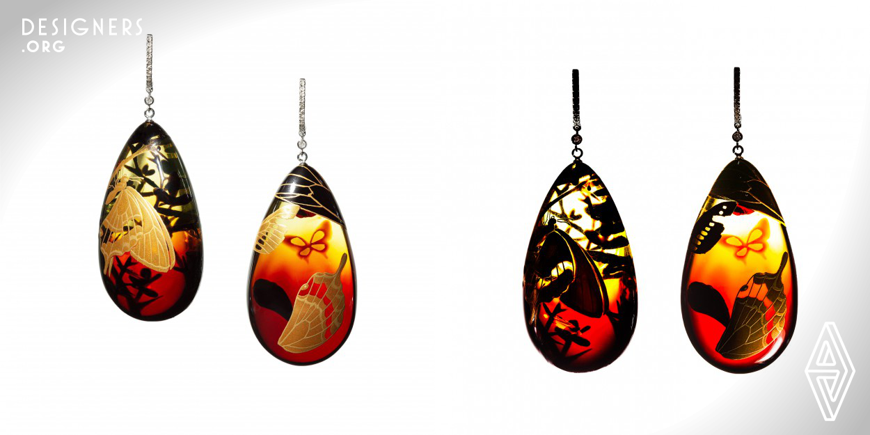Each designed as a suspending amber drop with Makie, a Japanese lacquer sprinkled with gold powder, mounted in 18kt white gold with brilliant-cut diamond accents. They show the moment of God’s intervention in a butterfly’s life, the moment of the butterfly’s emergence, and the moment of transformation to spirit. Diamonds express the flow of time in the universe and the eternal cosmos blinking. 