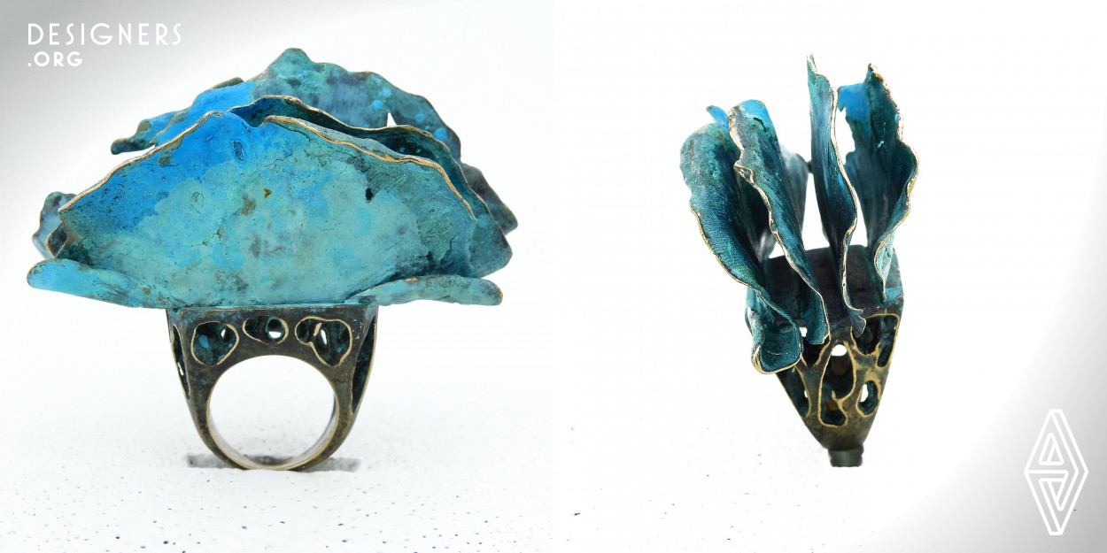 "Gingko I" ring is a research on the beauty of gingko leaves and natural patina that can be achieved with bronze. The base for the ring was carved manually from wax and then being cast in bronze. Four gingko leaves cast in bronze too and they are crowning the top in a sequence which creates a motion feeling. Different shades of blue and green patina finalizing the idea of motion by reminding a viewer about waves of an ocean.