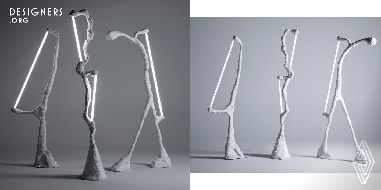 Aggregate is a floor lamp collection of three unique silhouettes classically sculpted with a variety of recycled materials: plastic, concrete, and steel.  Each piece strategically uses height and the angle of the LED tube bulbs to evenly diffuse refracted light into any large space. The resulting design is organic yet commanding, providing the bold emission of light from each distinct form.