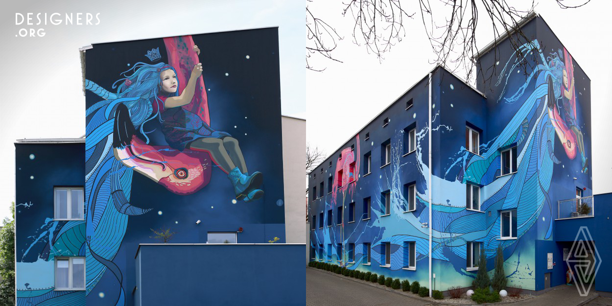 The mural was created for children’s hospice. The design is a metaphor for the transition between two worlds. The building’s walls were used to show the metaphor. The dark and starry universe contrasts with the huge pink bird. Pink flamingo symbolizes caring support. Girl’s hair is a symbol for imagination and free spirit.