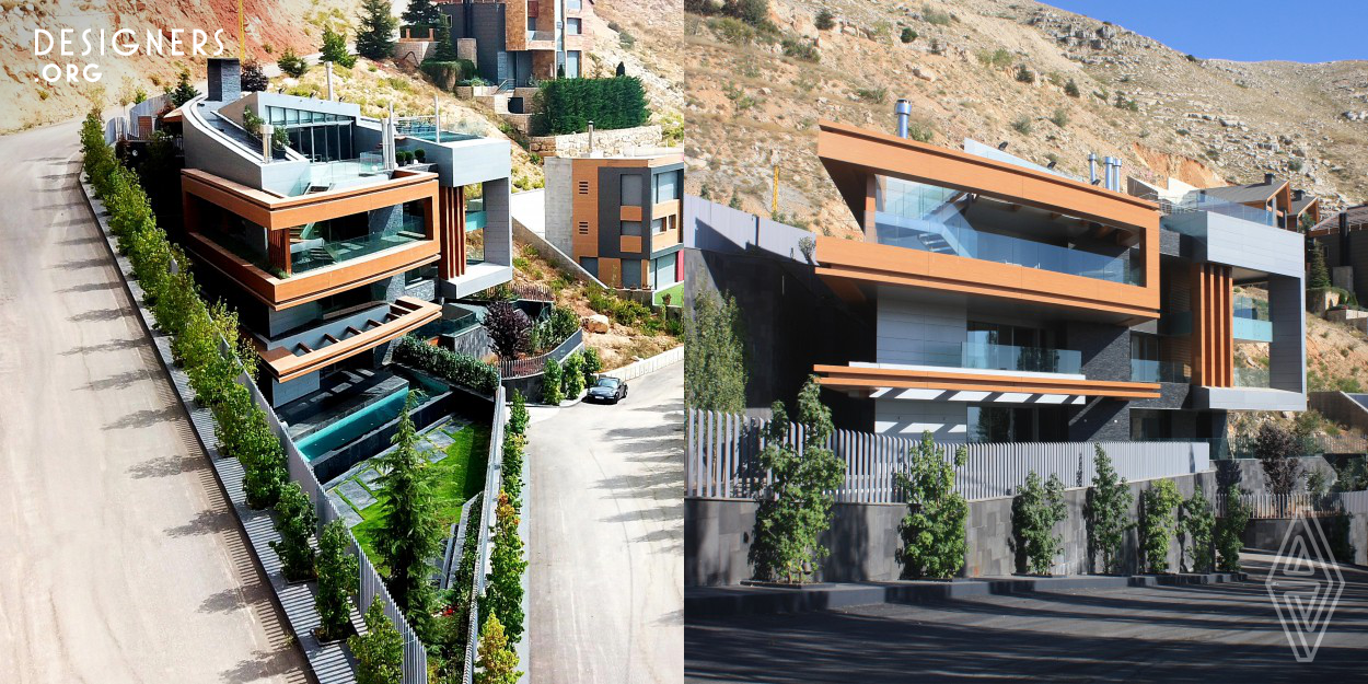At the summit of a steep hill, lies a private residential project built to provide their owners with a secondary residence. The project makes the use of a difficult terrain, in order to create a practical and aesthetically pleasing living space. In fact, the triangular plot, which is located on a steep slope, has a setback line that limits design possibilities. This challenging complexity called for an unconventional design. The result is an unusual proportioned triangular building.