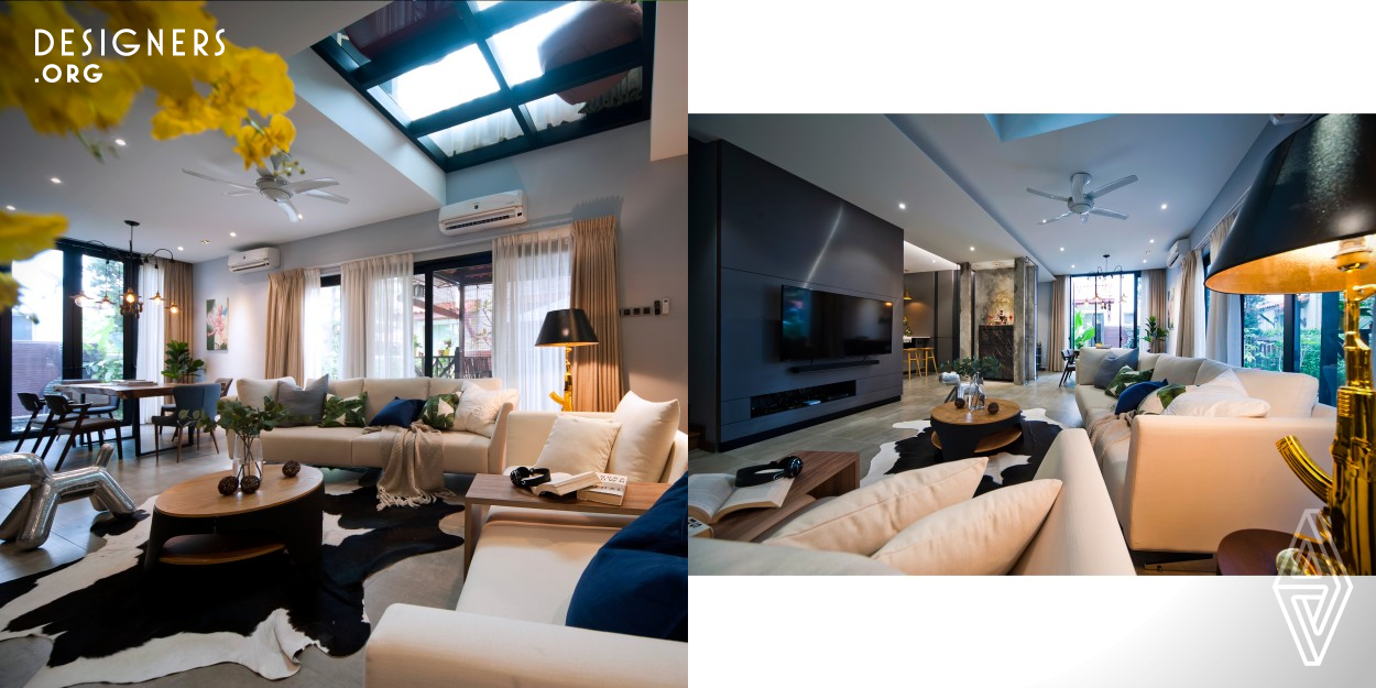 This semi-detached house is updated with a modern tropical concept that emphasises a warm, laid-back, resort-like ambience. Non-structural walls were removed to create an open space layout, which rectified existing lighting and ventilation issues. The addition of a 6-panel glass ceiling skylight at the living room brightens the interior with natural lighting. Furthermore, tall glass panels are installed in the living and dining area to take advantage of the peaceful garden view on top of expanding the interior visually. Cool urban hues and natural materials complete this sophisticated look.