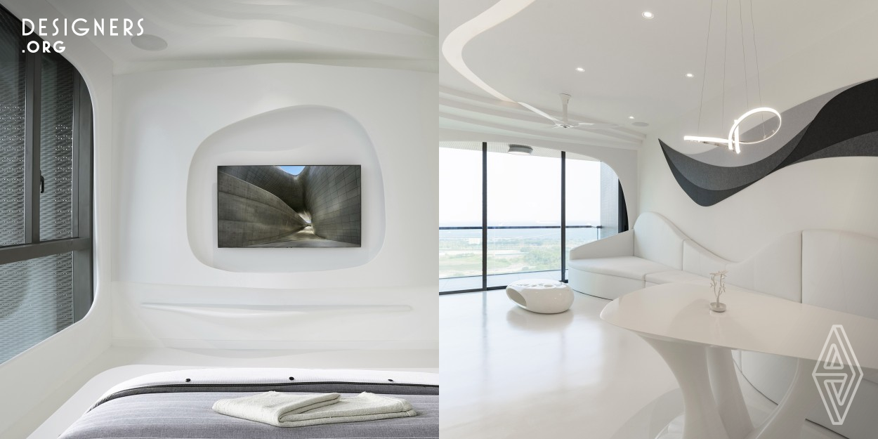 Inspired by the block-buster Sci-Fi movie 'The Passengers', this unit was well designed with monochromatic white color palette in contour lines in sophisticated fittings. The result was done with refined elegance with amazing visual environment of immersive and experiential experience with the help of technology. Incorporated with Smart Home, wireless lighting system that lets the user to create the right ambiance for every moment. This is the space where space, interior, furniture, media, user interaction and technology were integrated together.