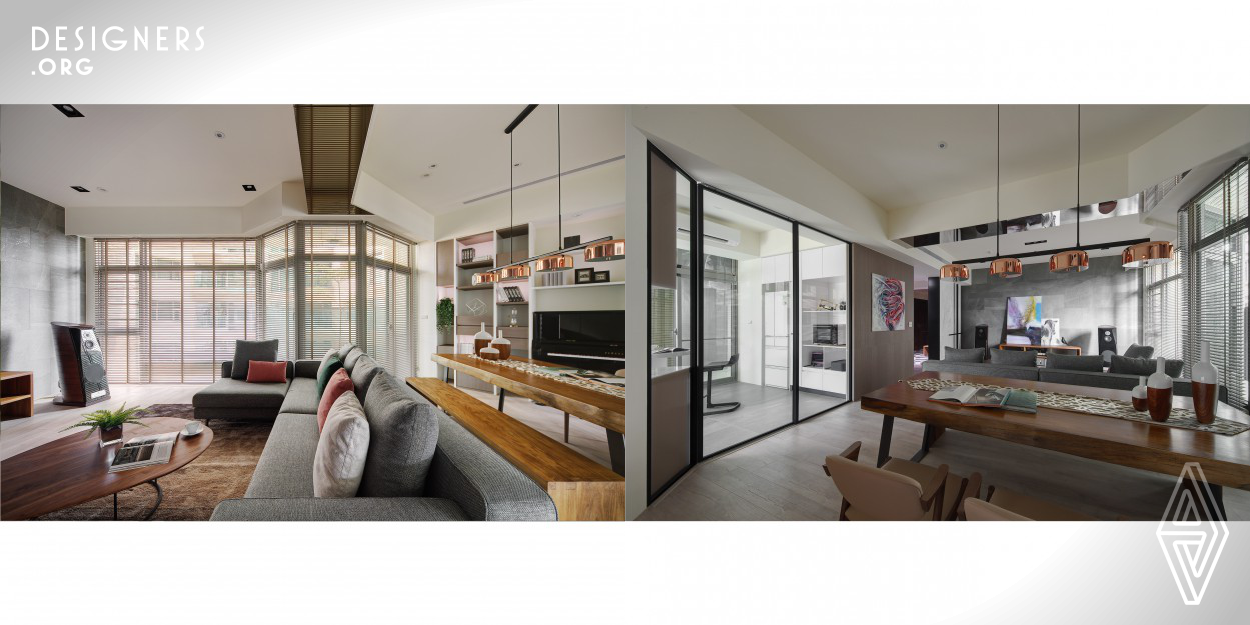 The Interior layout is not foursquare and the public area and the private area present a 45 degree angle of intersection. The designer connects the living room, dining room and kitchen to create a wide and bright fan-shaped space. Responding to the technical background of the male owner, white and grey color are chosen to be the main tone and warm wood furniture is decorated partially. The main wall of the living room is designed with the gray stone tiles which show the high ceiling of the public space. The light and shadow cleverly blend into the peaceful.