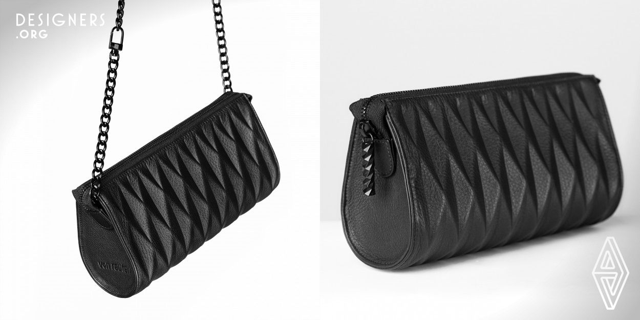 This is the smallest of three bags from the iconic design collection named TOKYO. The trademark of this assortment: The hand-embossed surfaces with 3D-diamond structure. The leather surface remains stitch free, soft and flexible at the same time. Every Bag has specials, so the Clutch: Hidden magnets on the side delicately shape the zipper for a perfect finish. A removable black chain or a nylon-leather-strap will keep your hands free. The Tokyo Collection from von rauten is multi-awarded and the design is protected.