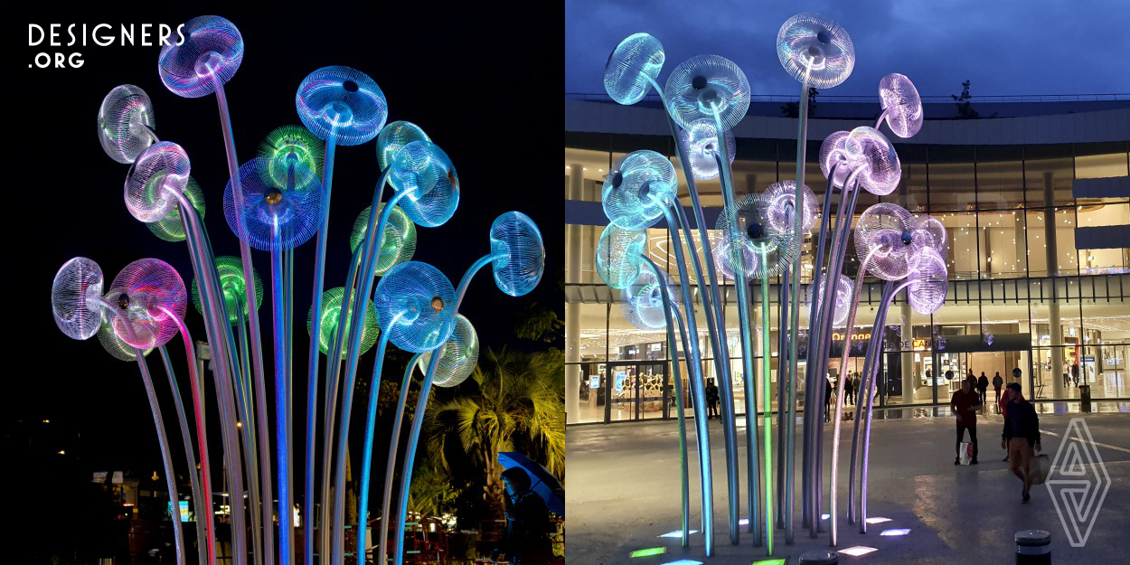 "Bubble Forest" is a public sculpture made of acid resistant stainless steel. The material has the property of reflecting both natural and artificial light. During the night, it is illuminated with programmable RGB LED lamps. It was created as a reflection on the ability of plants to produce oxygen. The title forest consists of 18 steel stems/trunks ending with crowns in the form of spherical constructions representing a single air bubble. “Bubble Forest” refers to the terrestrial flora as well as to that known from the bottom of lakes, seas and oceans.