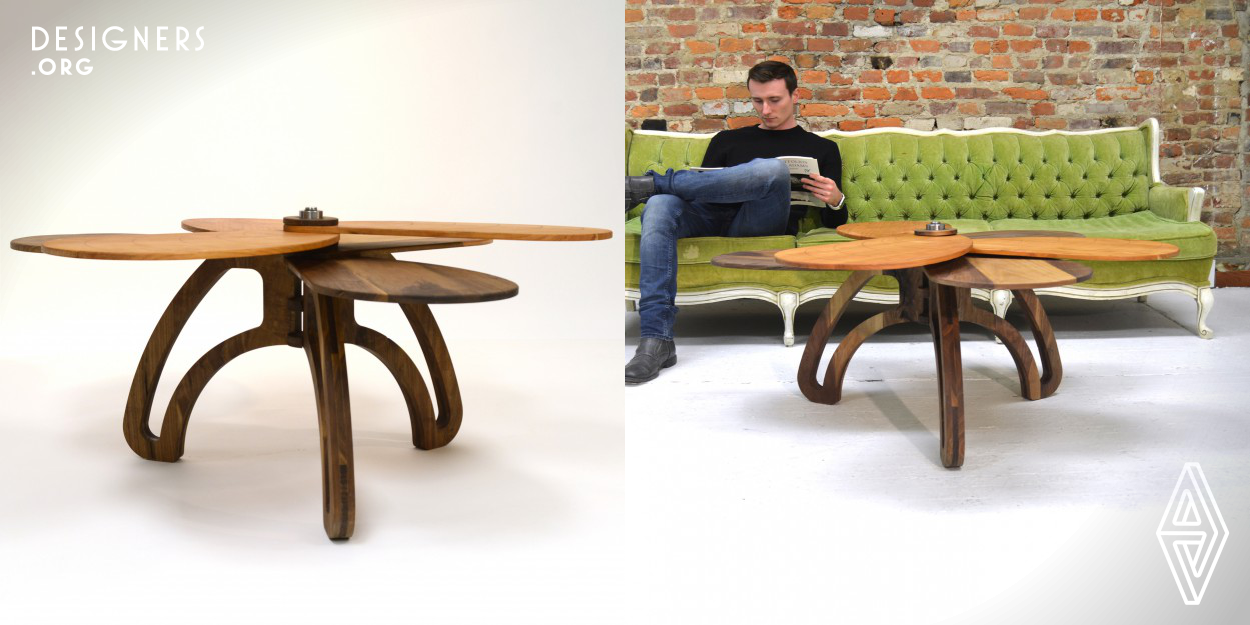 Samara is a multi-functional coffee table that incorporates removable lap desks. Taking inspiration from maple seed pods, the solid wood construction honors the locally sourced lumber from which it was made. The user can either enjoy Samara as a place to rest their drinks and books, or unscrew the top cap to take off the mini tray tables. These desks can then be used as work stations or surfaces off of which they can eat their food.
