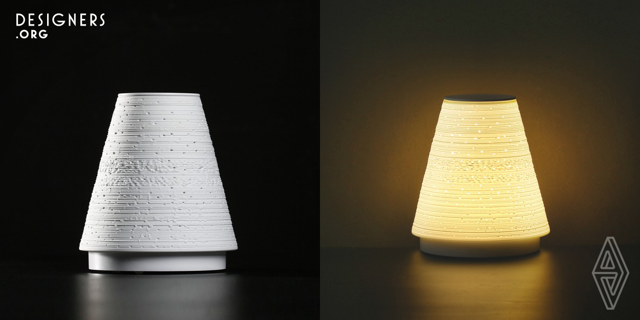 It is a combination of traditional hand-made eggshell porcelain and modern voice control light. It is an attempt to revive the folk arts that may not conform to the functions and aesthetics of contemporary society. The housing is ergonomic with a tapered design which is not only curved back to fit nicely in your hand, but also not easy to be knocked over. The point-line-surface carved texture like a shining night sky in the light. It can also have your hands free for the voice control function.