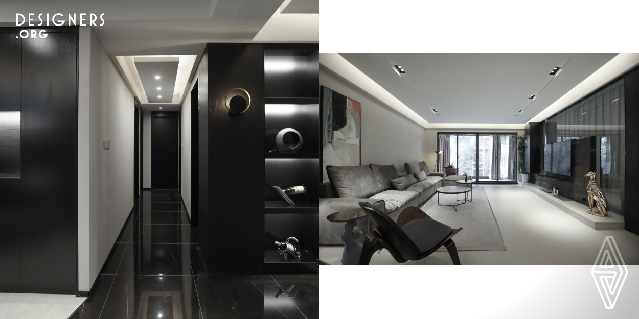 The residential design considers the habits, needs and tastes of each family member. Again according to appeal and building actual situation, rearrange each function area. 'less is more', using simple black, white and grey is the most direct visual touch. This space is designed with grey walls and grey polyurethane floors, and black cabinets to perfectly present the whole space. Designers find a balance between aesthetics and practicality in this space.