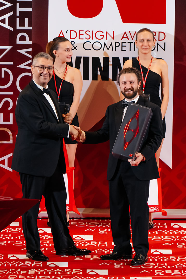 Award Winner Designer taking trophy at stage